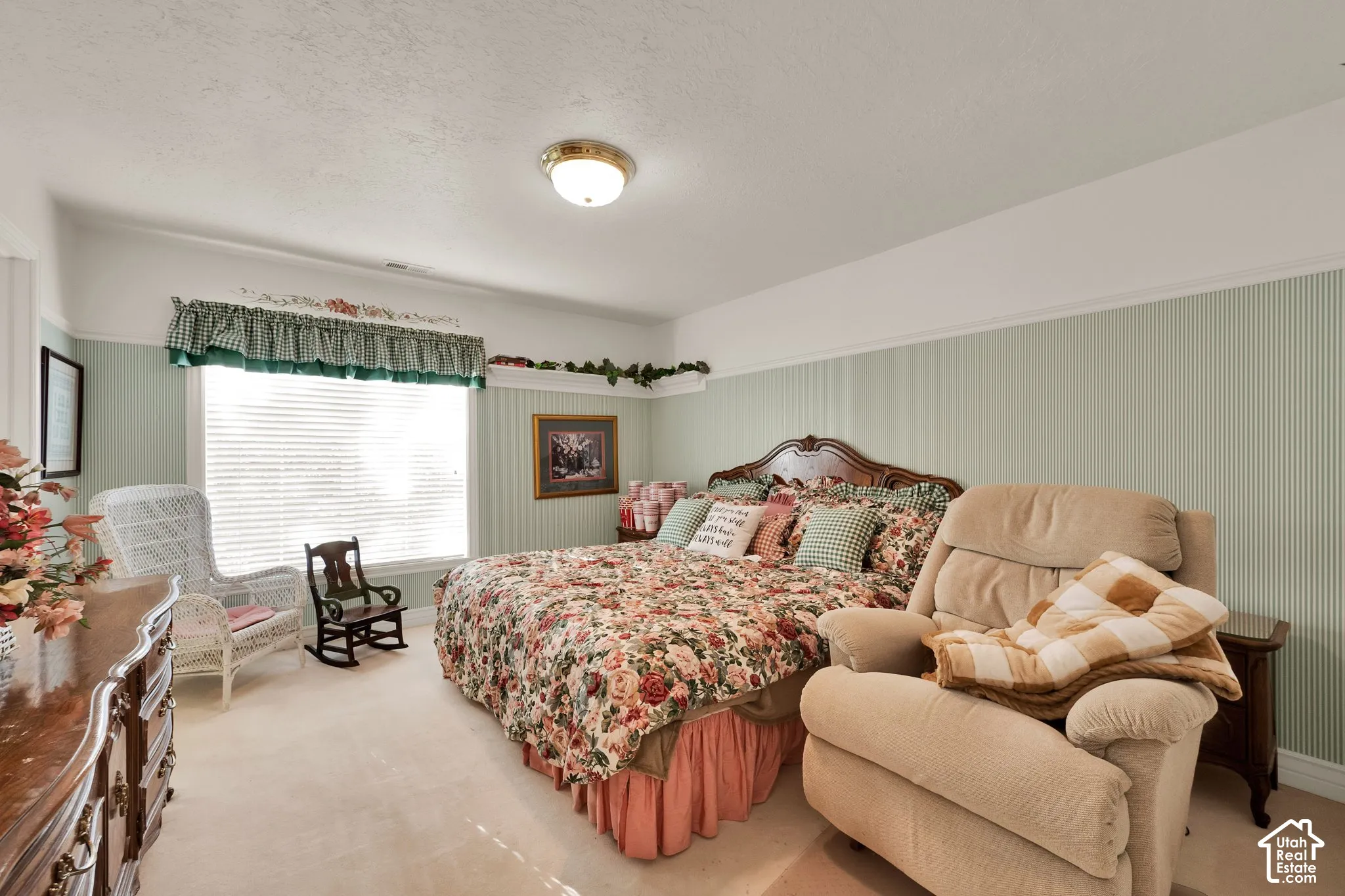 Interior space featuring two-tone wall treatments, wainscoting, decorative picture rail with integrated display ledge, and window blinds