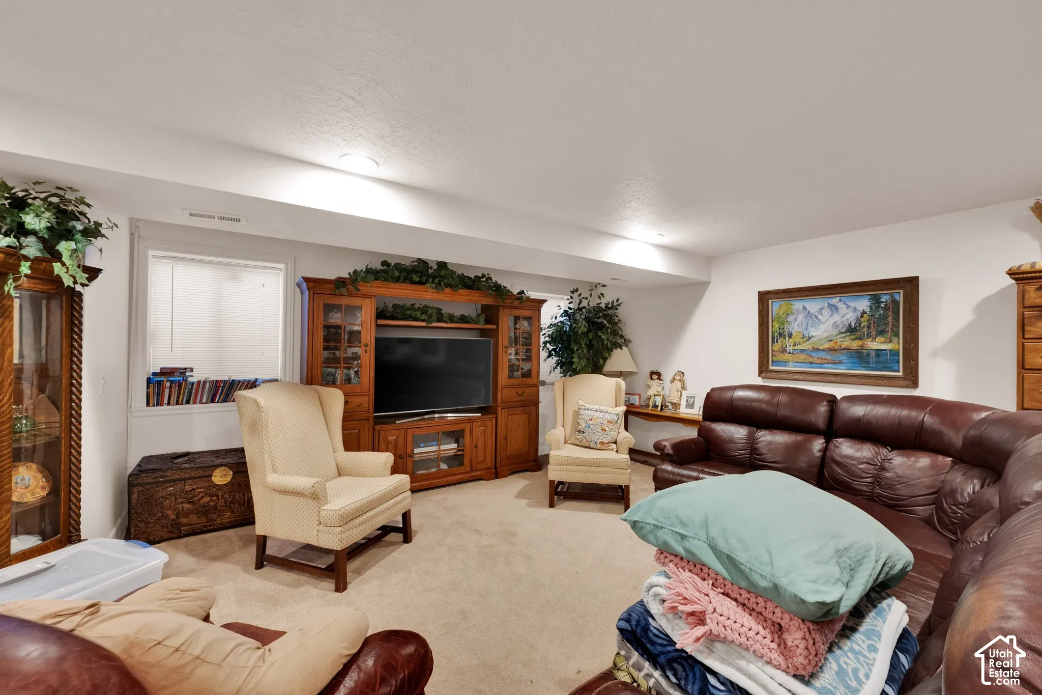 Built-in wood cabinetry with integrated shelving and recessed lighting