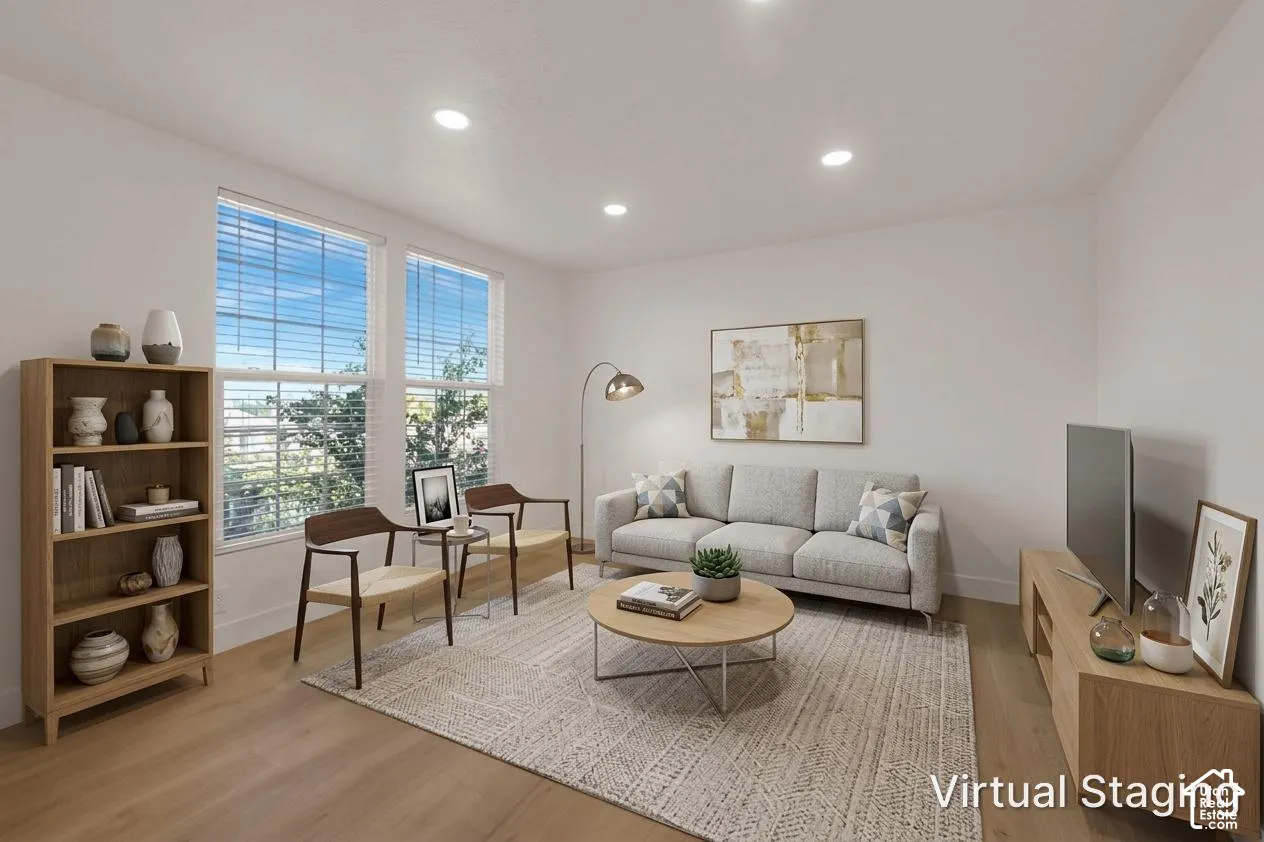 Neutral-toned interior featuring wood-finish flooring, recessed lighting, and dual pane windows