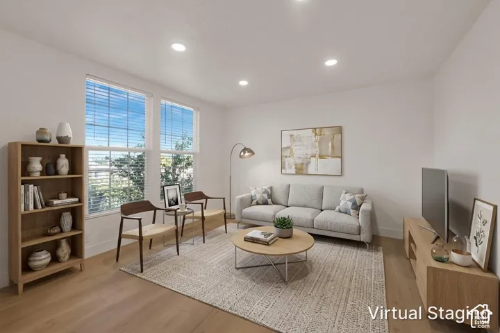 Neutral-toned interior featuring wood-finish flooring, recessed lighting, and dual pane windows