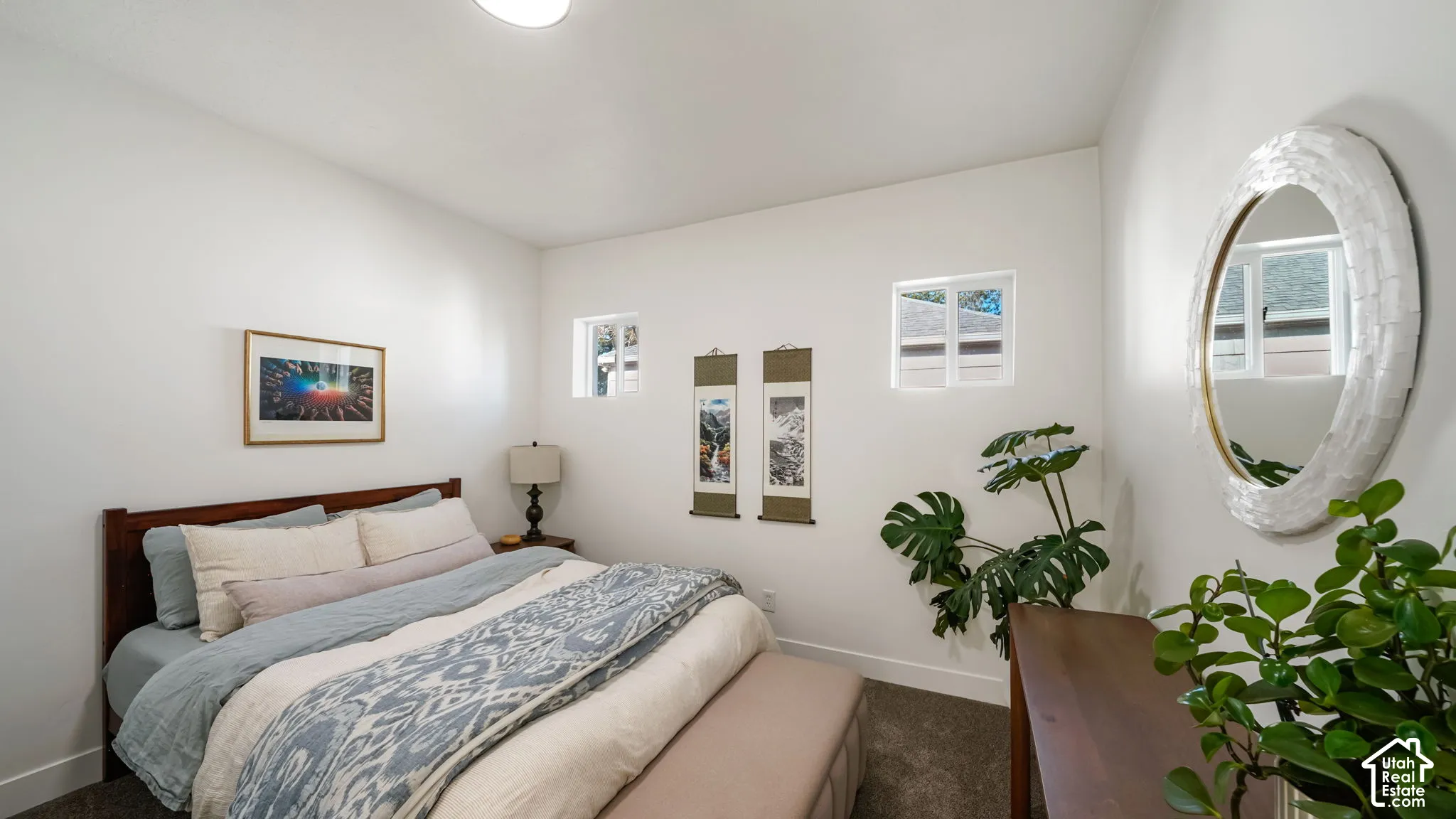 Neutral interior space featuring high-pile carpeting, neutral wall color, and two square high-set windows