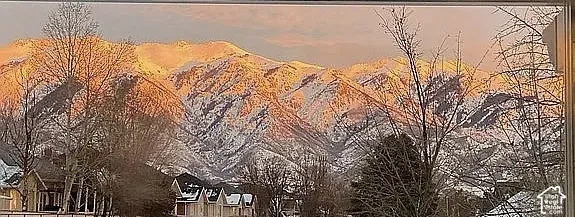 Snow-capped mountain peaks featured prominently against the horizon