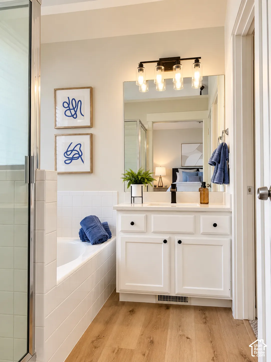 Primary ensuite, new flooring, lighting, paint, quartz countertop, faucet