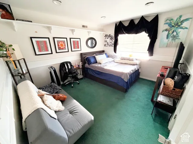 Recessed ceiling lighting, horizontal wall-mounted shelving, chair rail molding, and window blinds