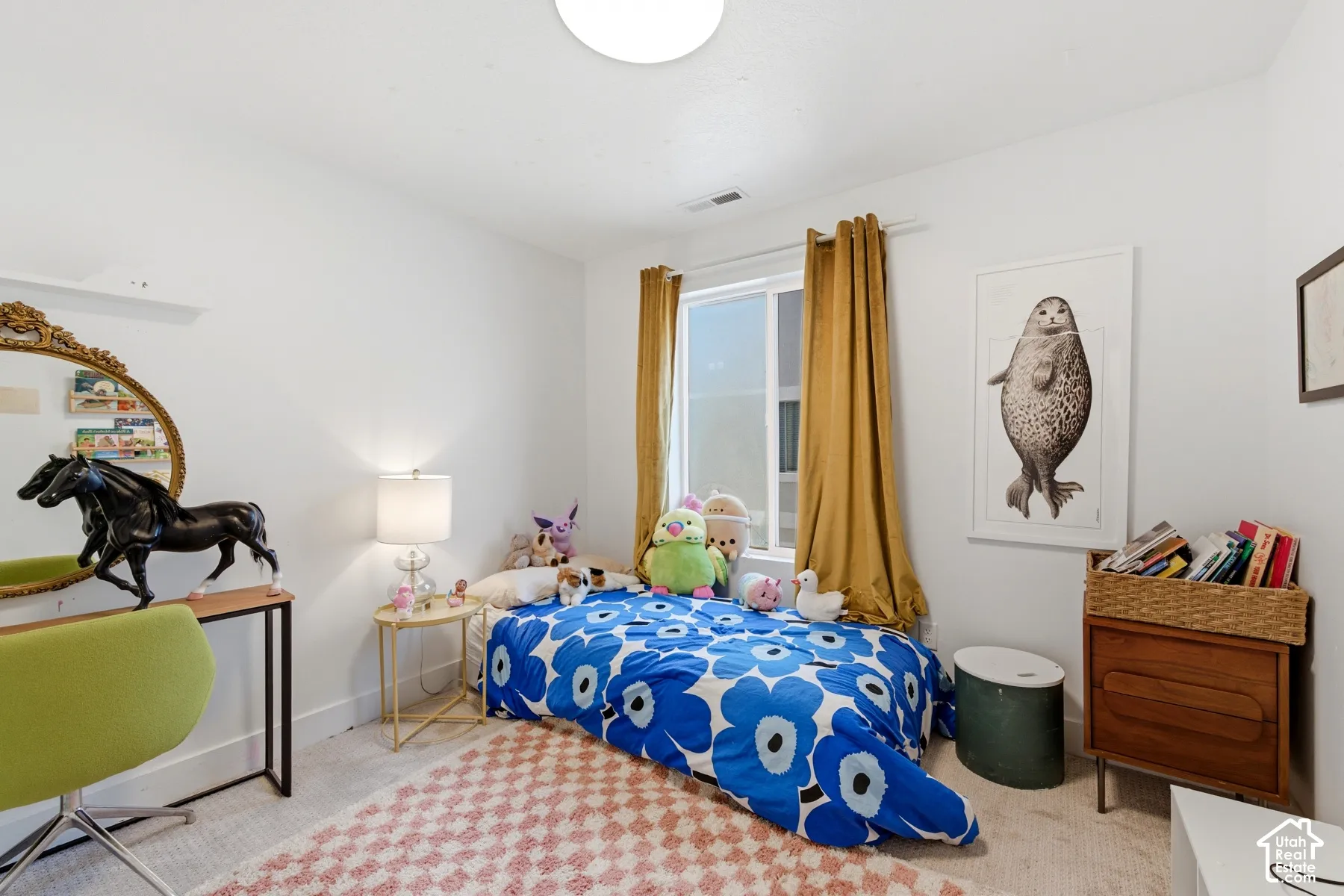 Neutral-toned interior space featuring wall-to-wall carpeting, white walls, and a window with a curtain rod