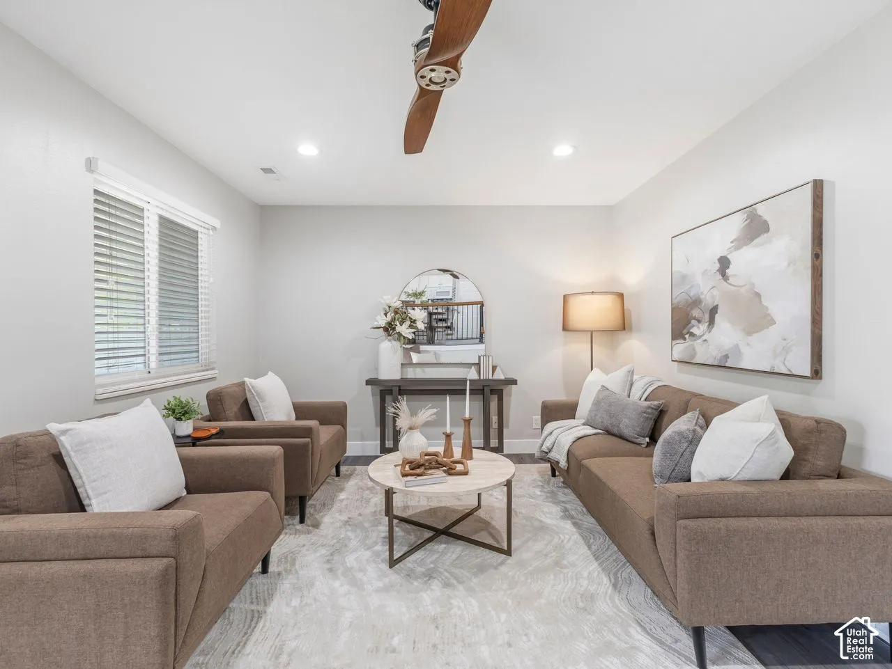 Neutral-toned room featuring recessed lighting, a wooden propeller-style ceiling fan, and window blinds
