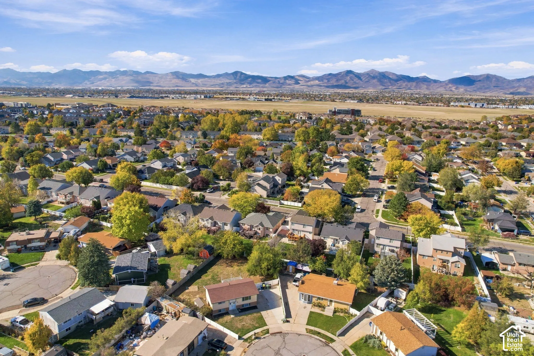 Aerial view of the neighborhood with mountains on the horizon