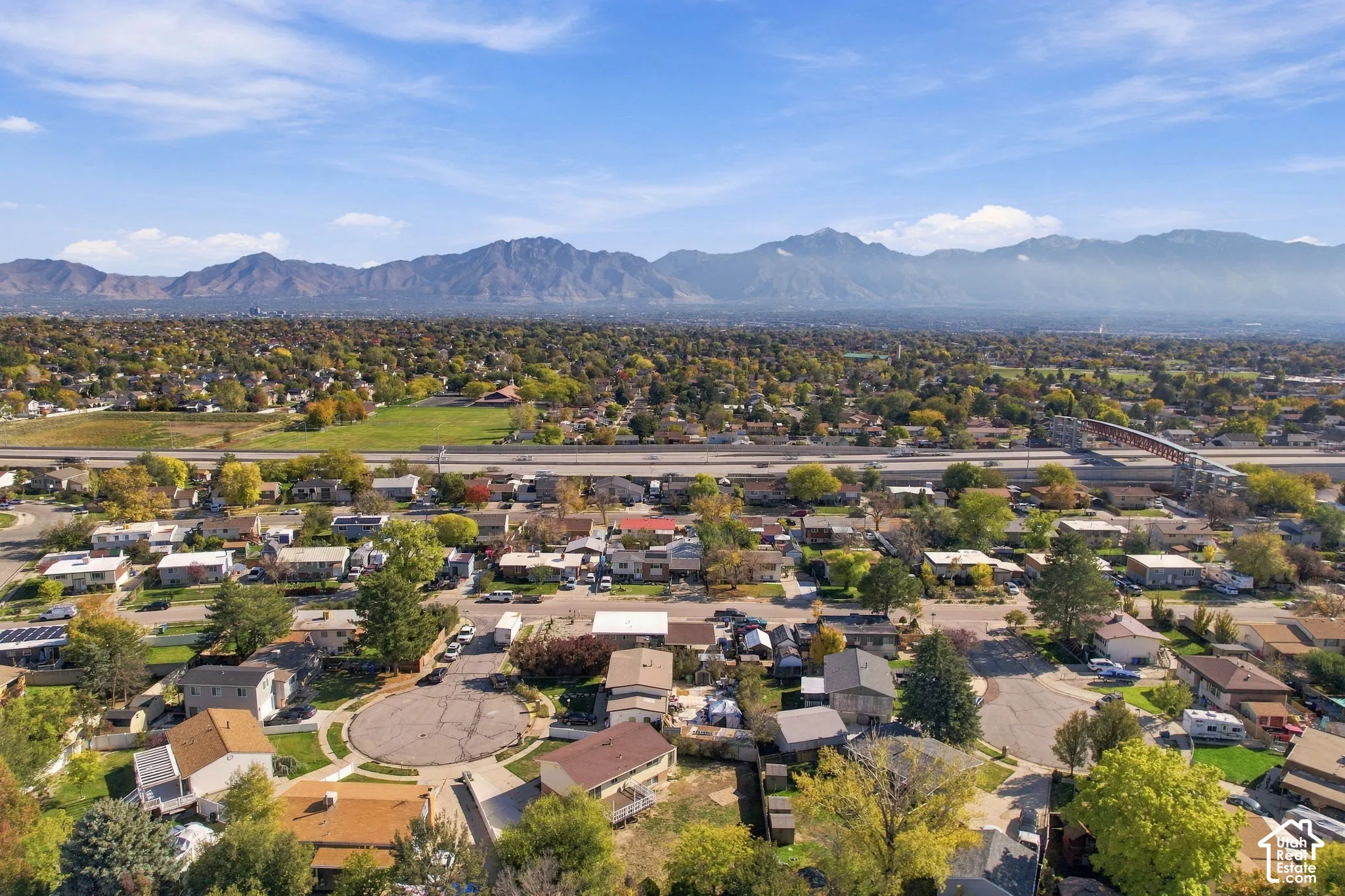 Aerial view over the neighborhood looking toward the mountains