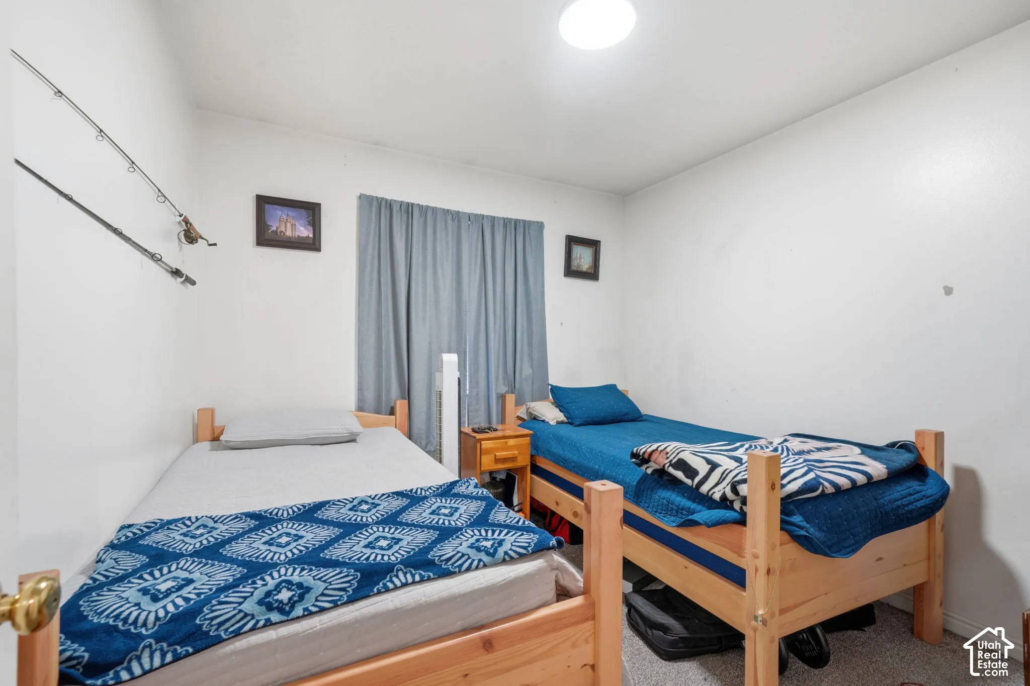 Interior room featuring neutral wall finishes, carpeted flooring, and a flush-mount overhead light fixture