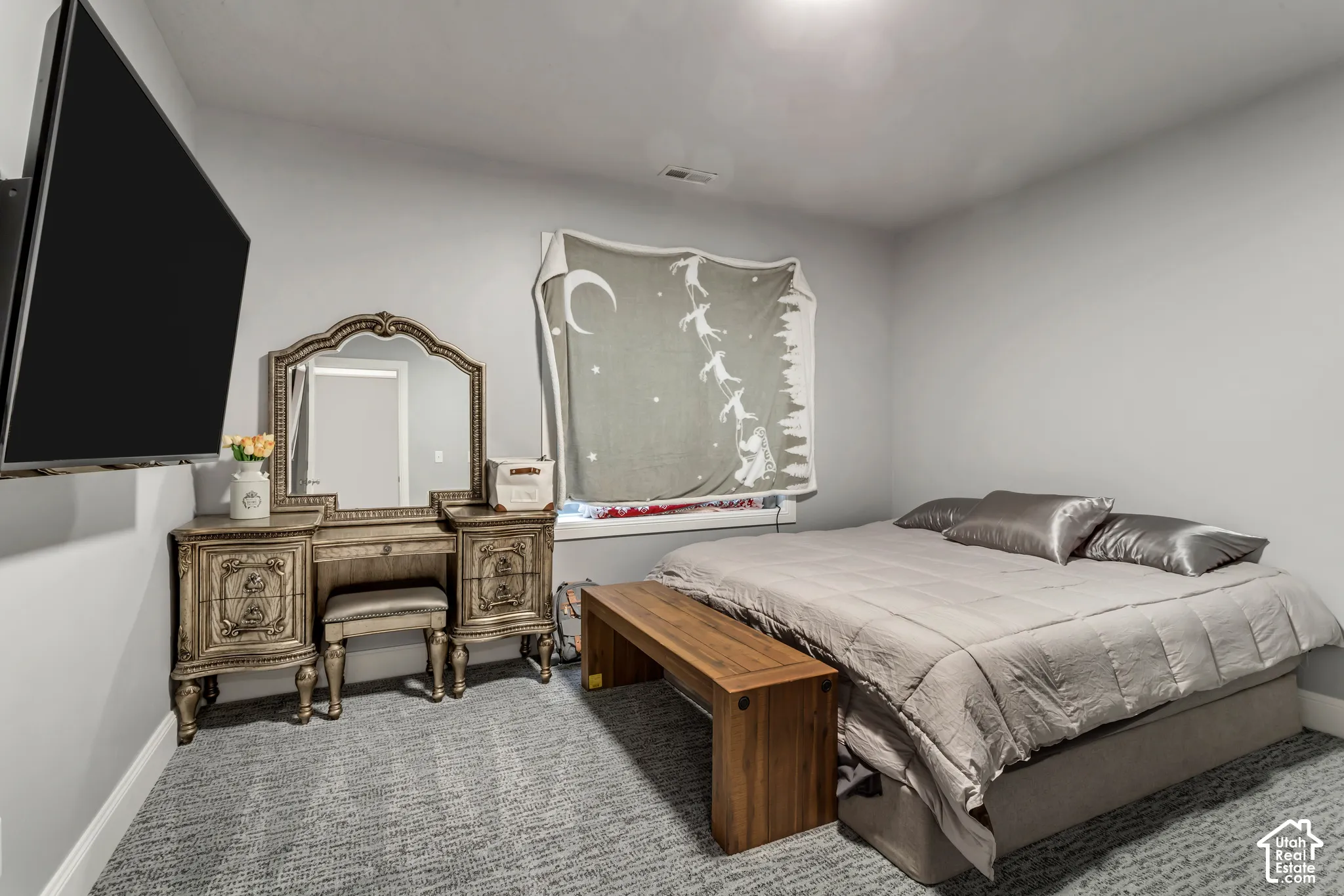 Room featuring neutral wall tones and wall-to-wall carpeting