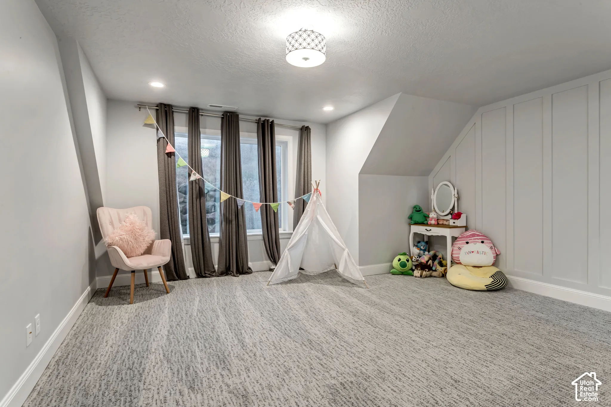 Room featuring wall-to-wall carpeting, recessed lighting, a drum-style ceiling fixture, large windows, and custom vertical wall paneling