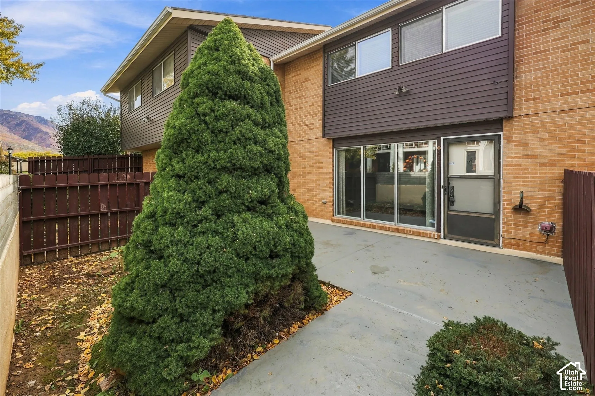 Exterior featuring a brick and horizontal siding fa