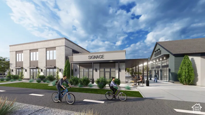 Multi-building complex featuring brick and lap siding exterior, paved pathways, manicured landscaping, and a covered outdoor patio area