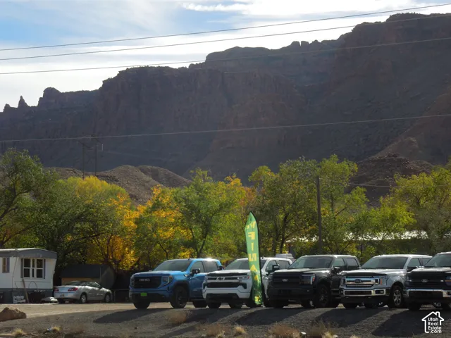 Expansive desert mountain backdrop featuring prominent rock formations