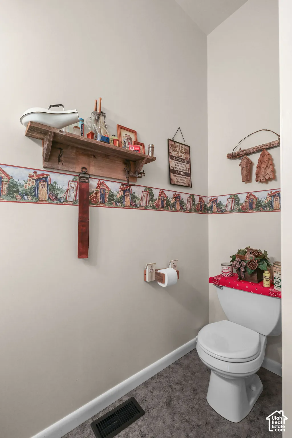 Wall-mounted rustic wooden shelf with integrated hardware and a coordinating wooden toilet paper holder