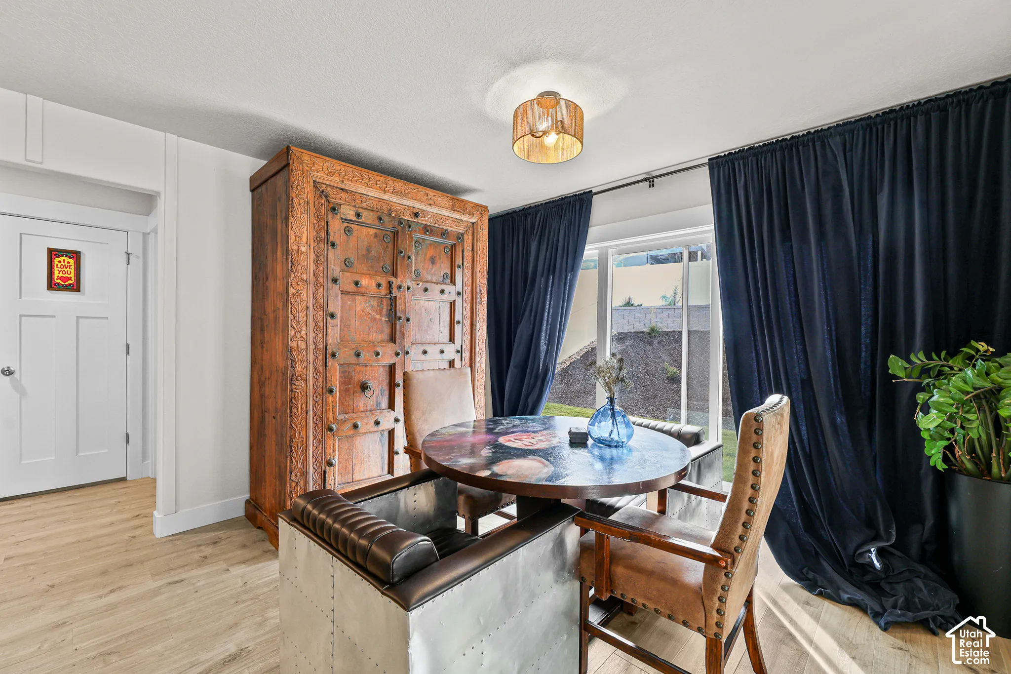 Wood-finish flooring, recessed lighting, and large window with natural lighting