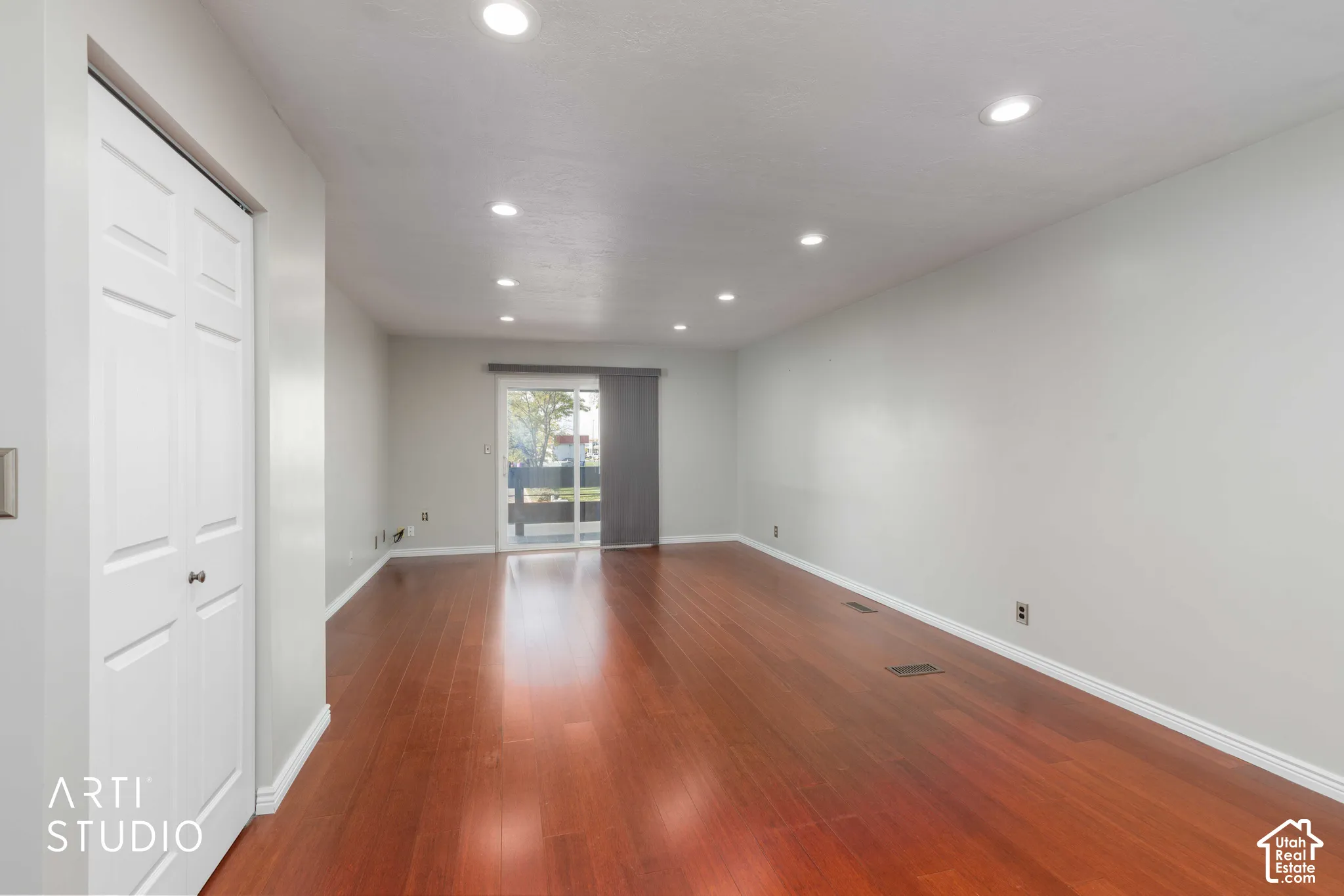 Interior space featuring wood-finish flooring, recessed lighting, and sliding glass doors with exterior access