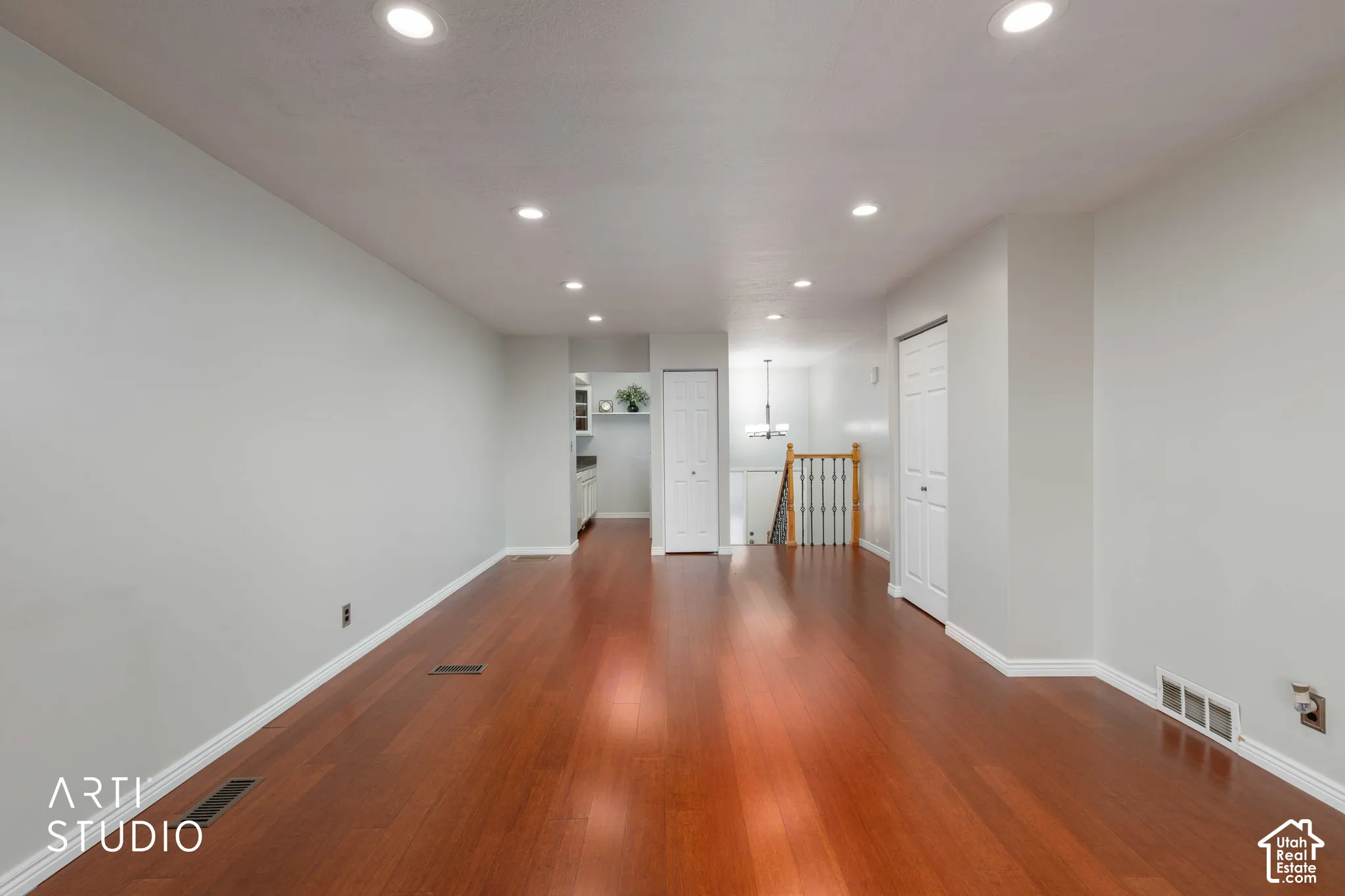 Interior space featuring wood-finish flooring, recessed lighting, and a neutral color palette