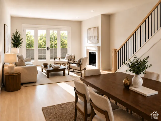 Open floor plan featuring classic full height windows and French doors  to covered deck. Detailed base and case & wood bannister.Fireplace not available in this unit.