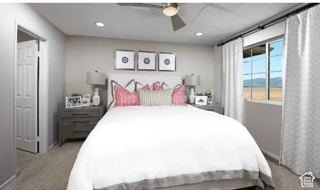Neutral wall coloring, recessed lighting, ceiling fan with light fixture, carpeted flooring, and window with mountain scenery