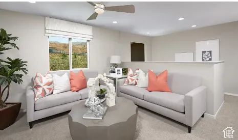 Neutral-toned interior featuring recessed lighting, a modern ceiling fan, wall-to-wall carpeting, and a half-height partition wall