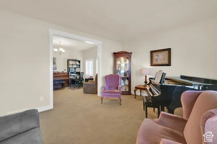 Neutral wall color with thick white door casing, wall-to-wall carpeting, and white window shutters