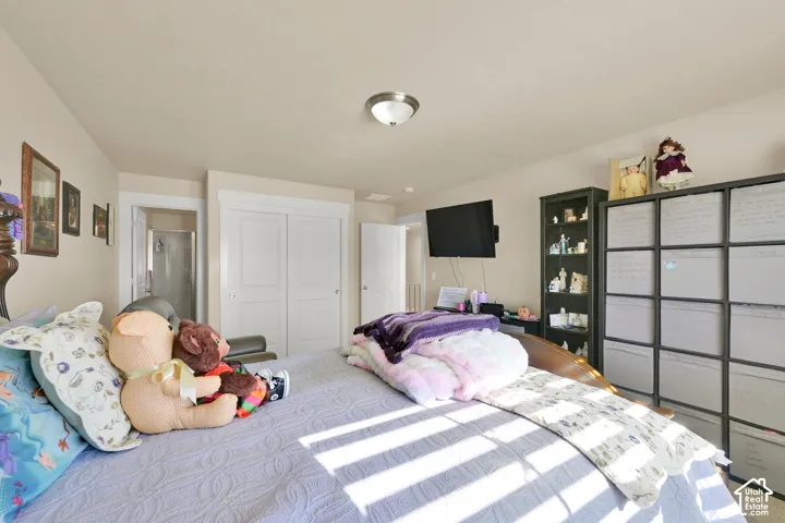 Room featuring two-panel interior doors, crisp white door casings, and a flush-mount brushed nickel lighting fixture