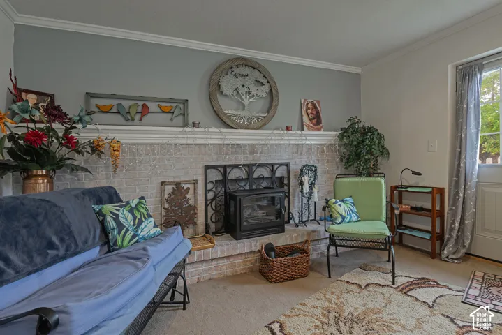 Fireplace featuring a light-toned brick surround, a built-in hearth, a mantel shelf, and a cast-iron stove insert