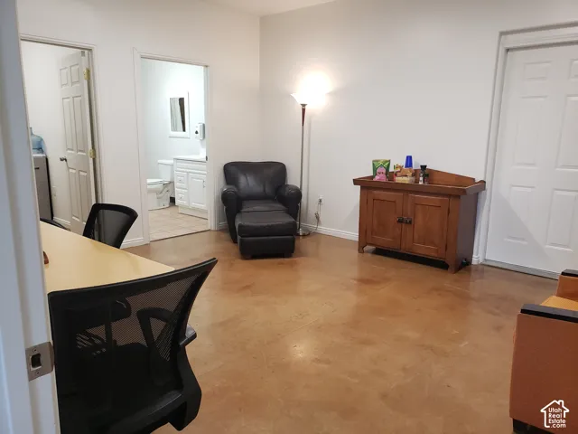 Stained concrete flooring, multi-panel interior doors, and neutral wall tones