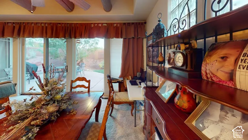 Exposed ceiling beams, sliding glass doors, and glass block windows