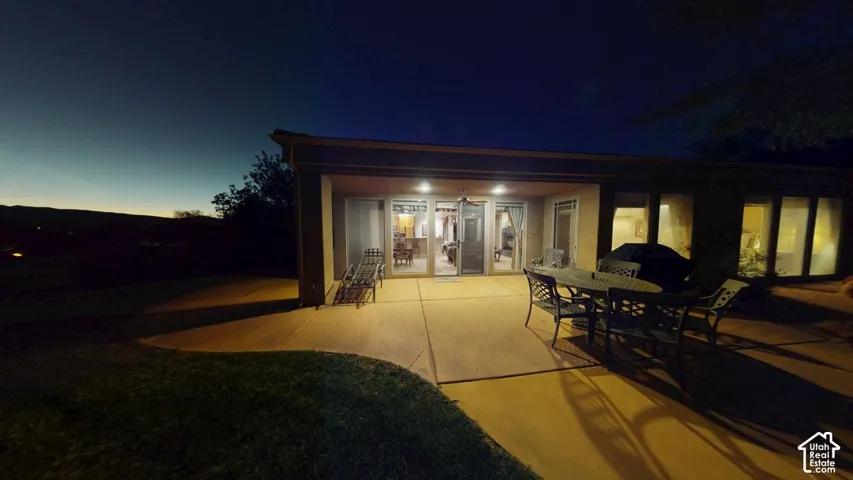 Covered concrete patio featuring recessed lighting and floor-to-ceiling windows