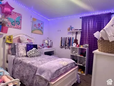 Wall-mounted shelving, built-in open storage cubbies, and recessed ceiling lighting accents