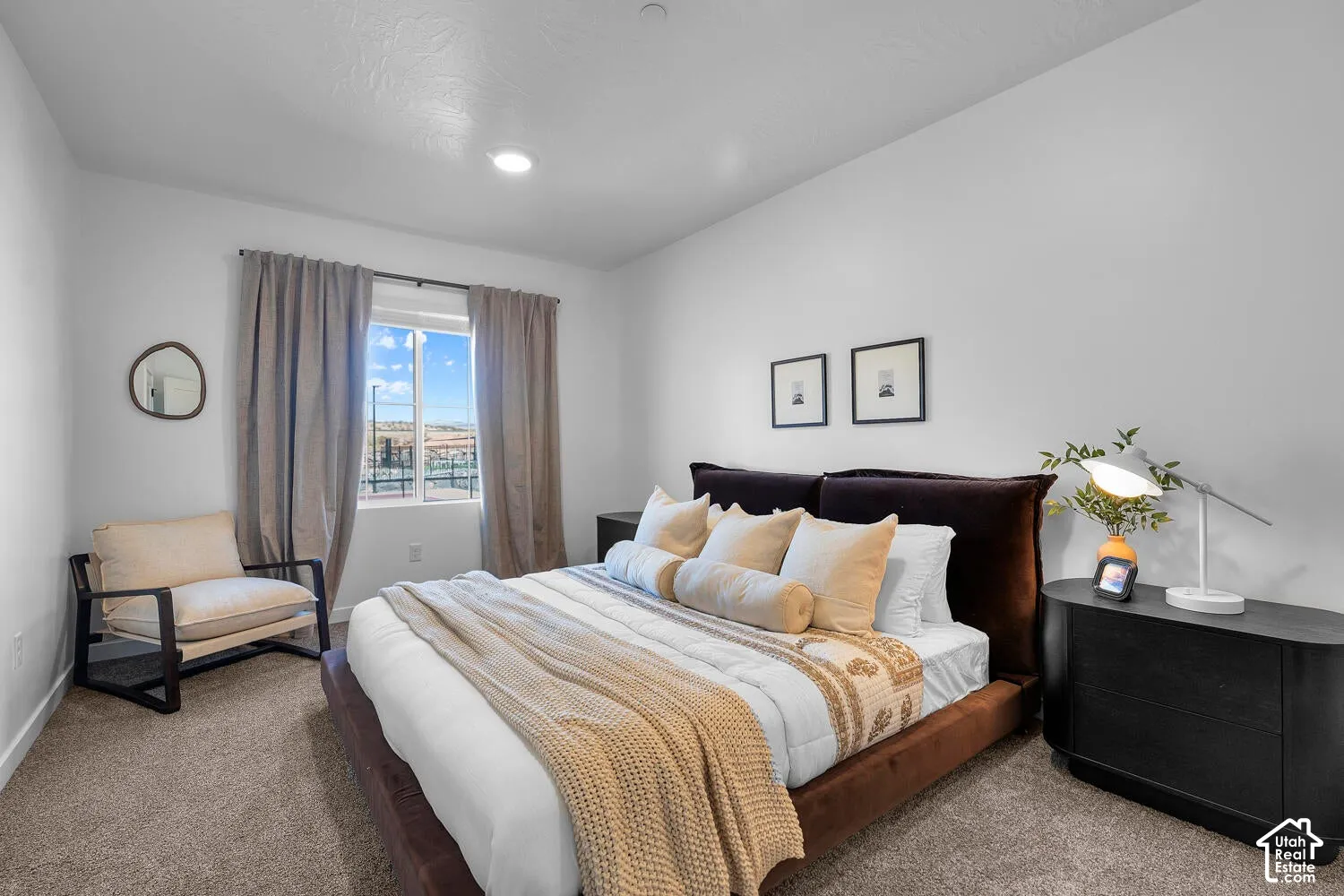 Neutral wall palette featuring recessed lighting, wall-to-wall carpeting, and a single-pane window