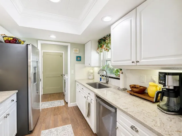 Kitchen: Pocket Door to the Pantry, W/D, & Garage Entry
