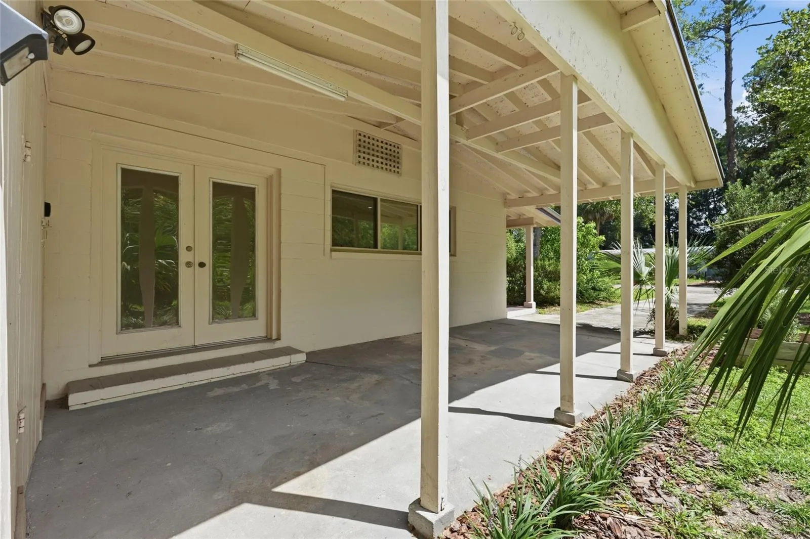 Carport and French Door Entrance