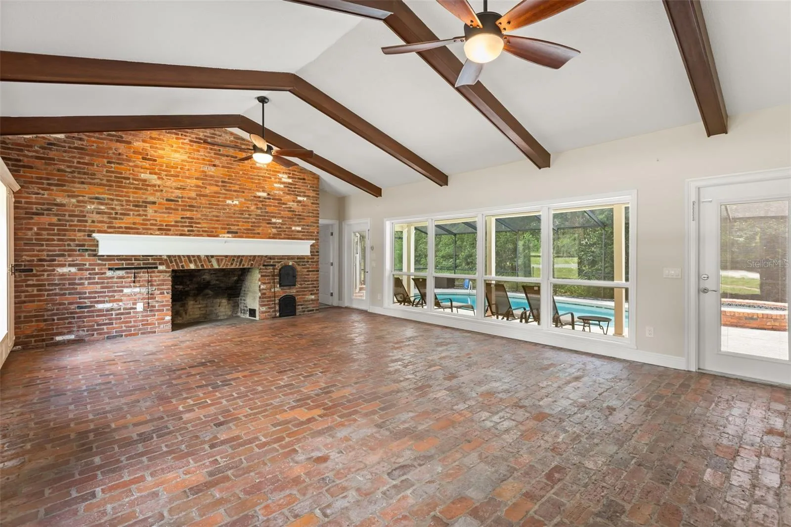 Family Room with view of Lanai and Pool