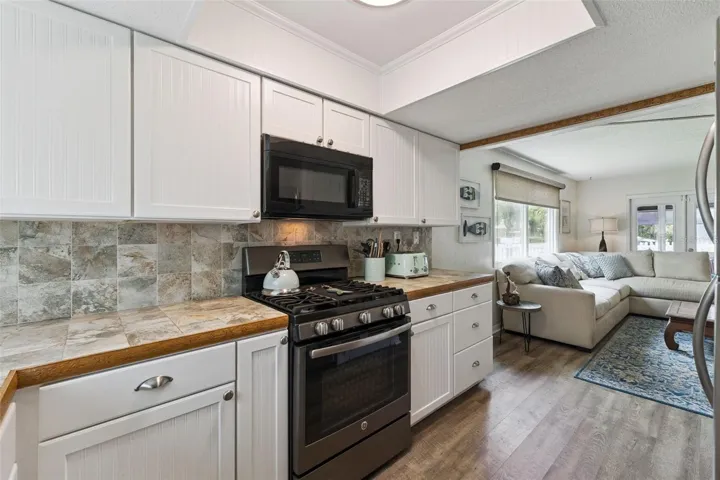 Two entrances to kitchen making it open to living areas