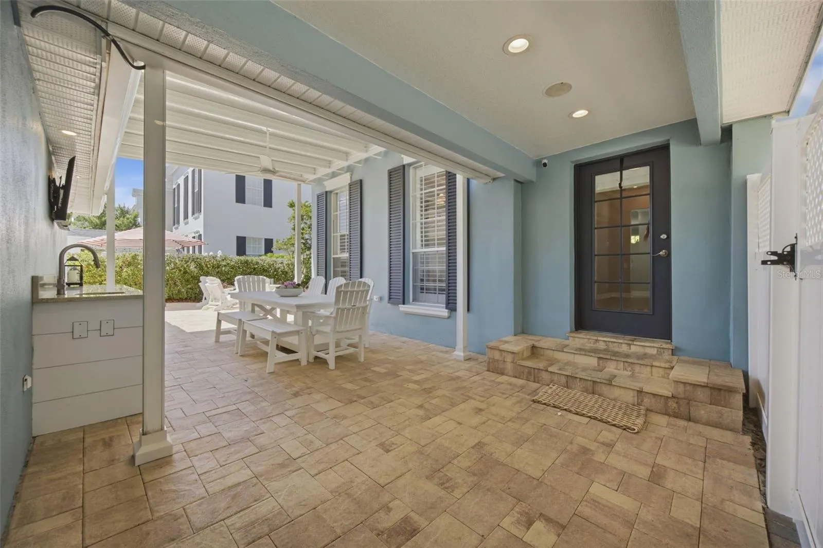 Breezeway connects main house to garage and gate to street.