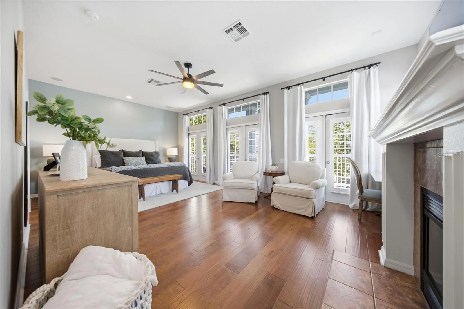 Large primary suite with sitting area and fireplace.