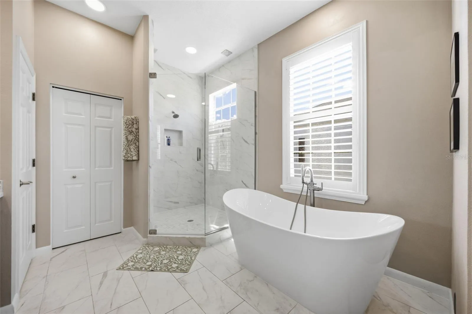 Large frameless shower and soaking tub.