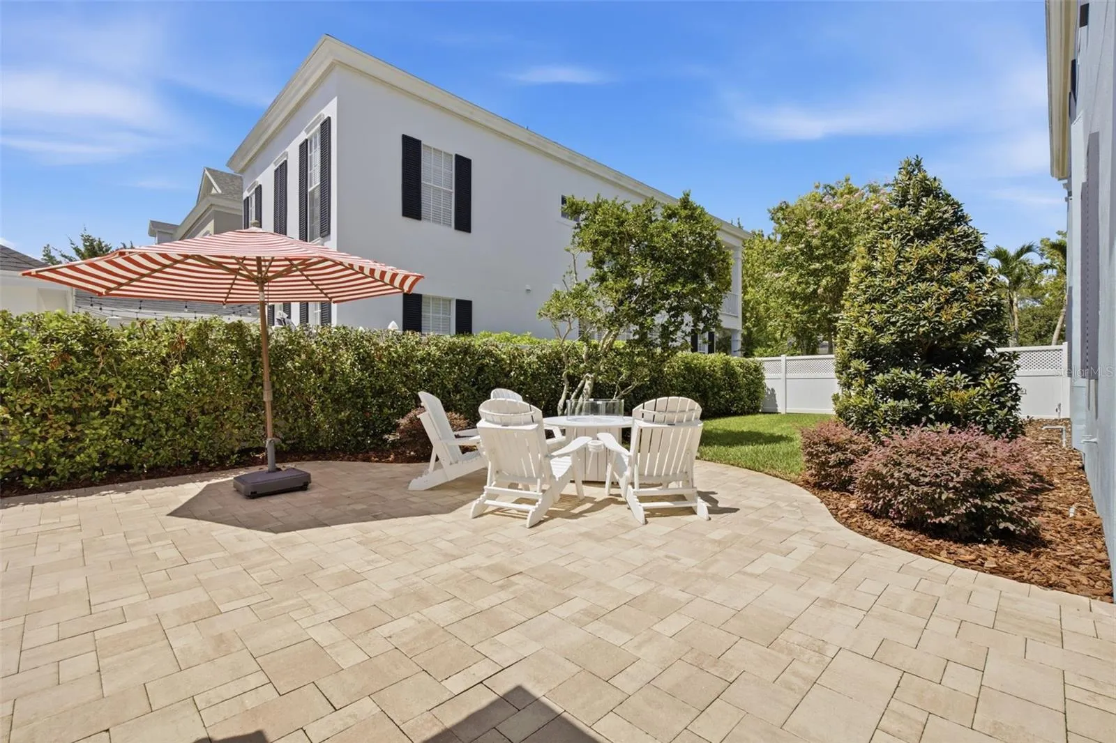 Huge paved back yard patio area.