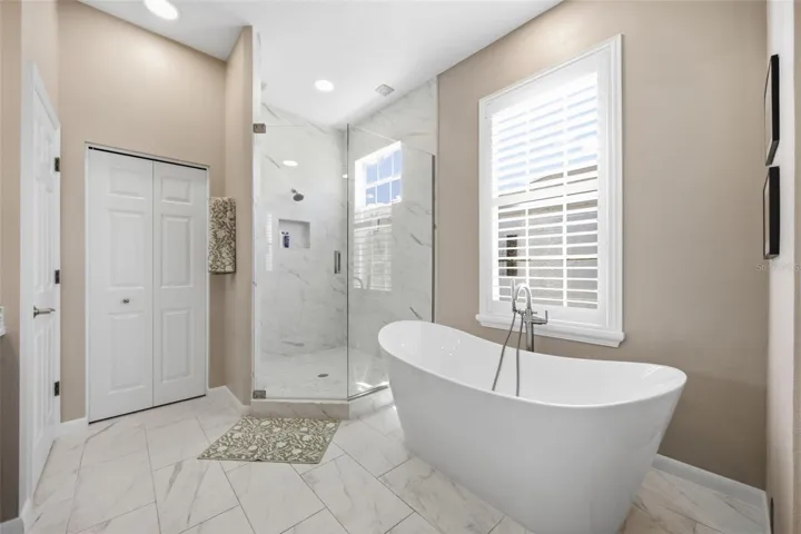 Large frameless shower and soaking tub.