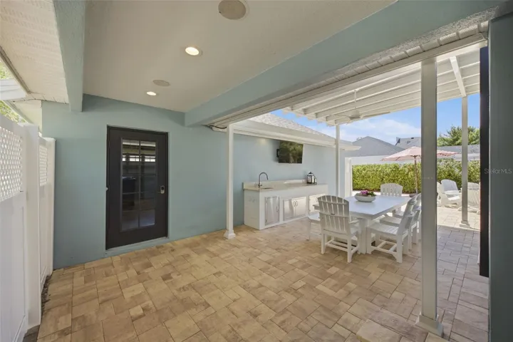 Outdoor breezeway to 3 car garage and remodelled back yard.