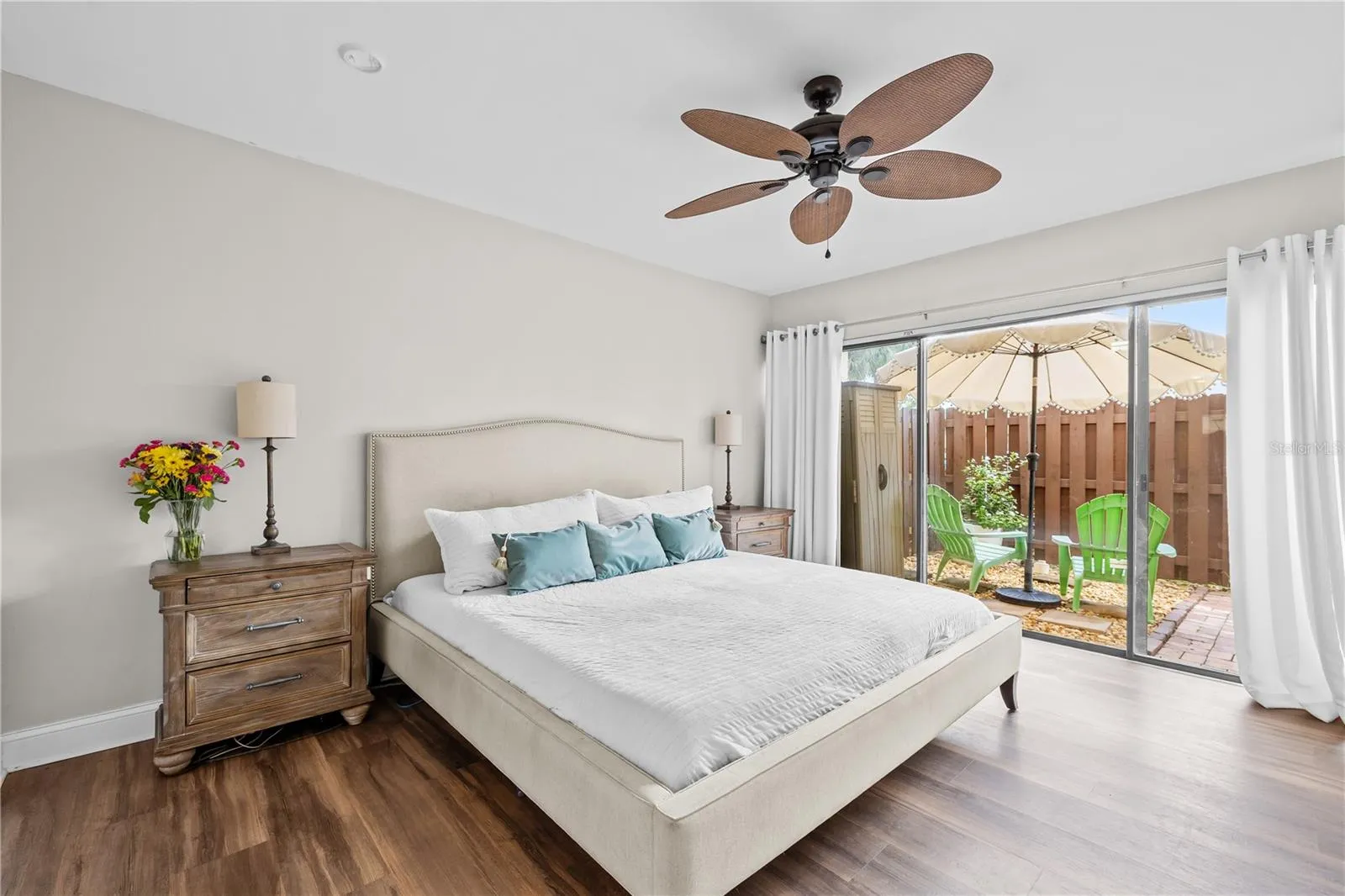Roomy primary bedroom with plenty of room for a king bed and more, with sliders to your private backyard patio