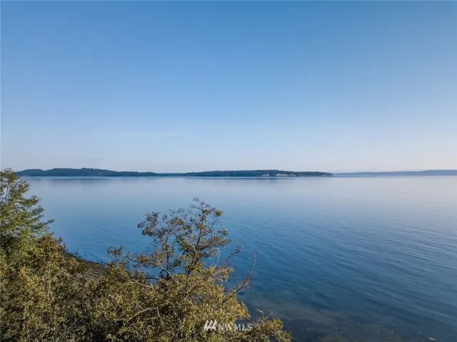 Shipping lane views. The parcel is a double lot with 120 ft of waterfront. In a great neighborhood.