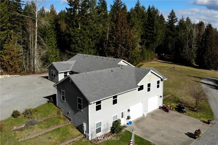 Beautiful views and privacy! Great driveway/garage area with an abundance of level space and room for  RV parking... Boats... Toys... multiple vehicles. Plenty of room to spread out and enjoy nature on this 15+acre home site.