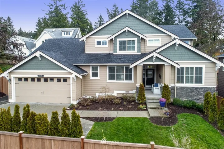 Craftsman style home on the edge of town close to everything yet just steps from Moritani Preserve.