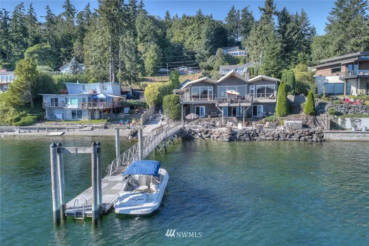 100 feet of low bank Southern exposure waterfront with your own private boat ramp and 100 foot long dock