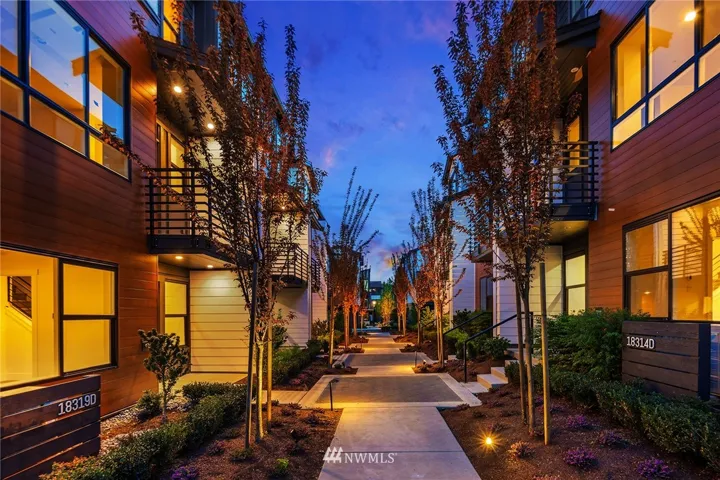 A beautiful, lush space called the paseo. Thriving landscaping is cared for by the Association; walking paths lead you to the library and amenities to the east.