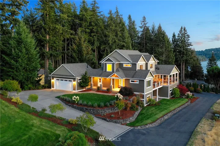 Impeccable landscaping adds to the charming curb appeal that beckons you home. Built in 2011, this custom craftsman home features stunning water views, and unsurpassed luxury that you won't find in new construction.